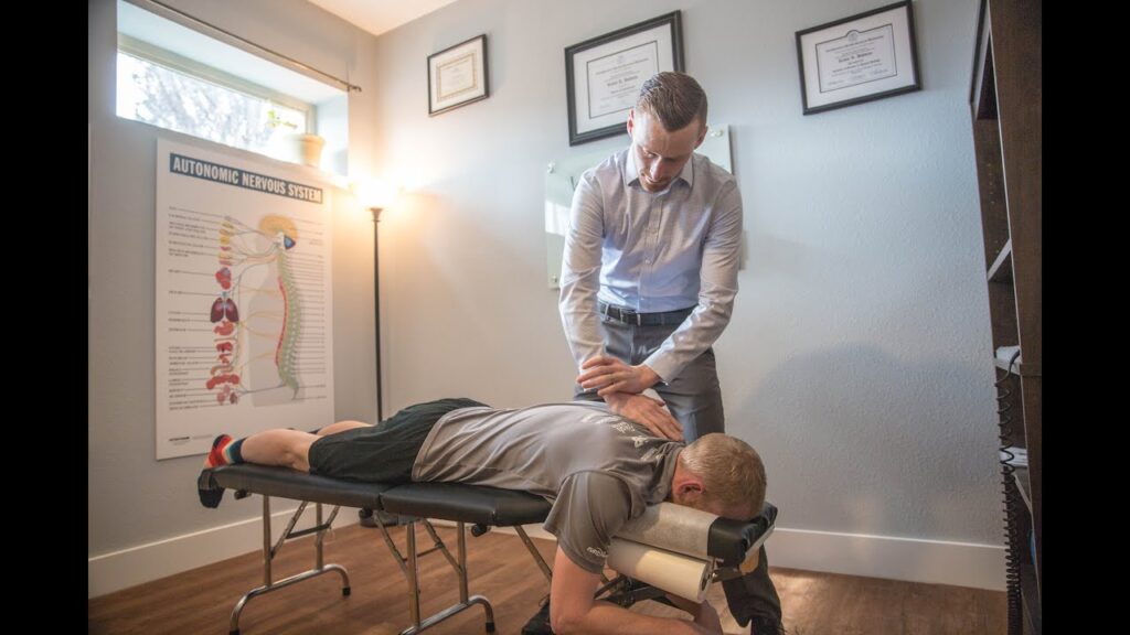 Dr. Holman doing back pain treatment in hastings